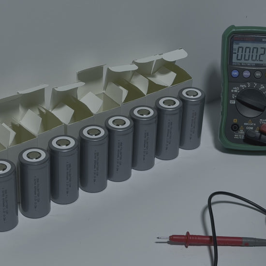 testing each 32700 cell with a multimeter showing a consistent 3.206 to 3.207 volts on each cell